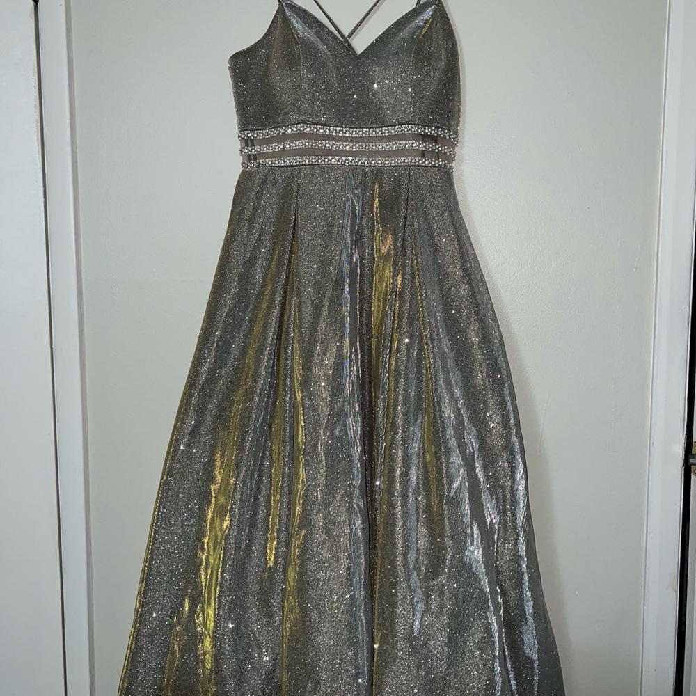This dress is from Azaria Bridal. It is a size 14 but can be hemmed to fit.